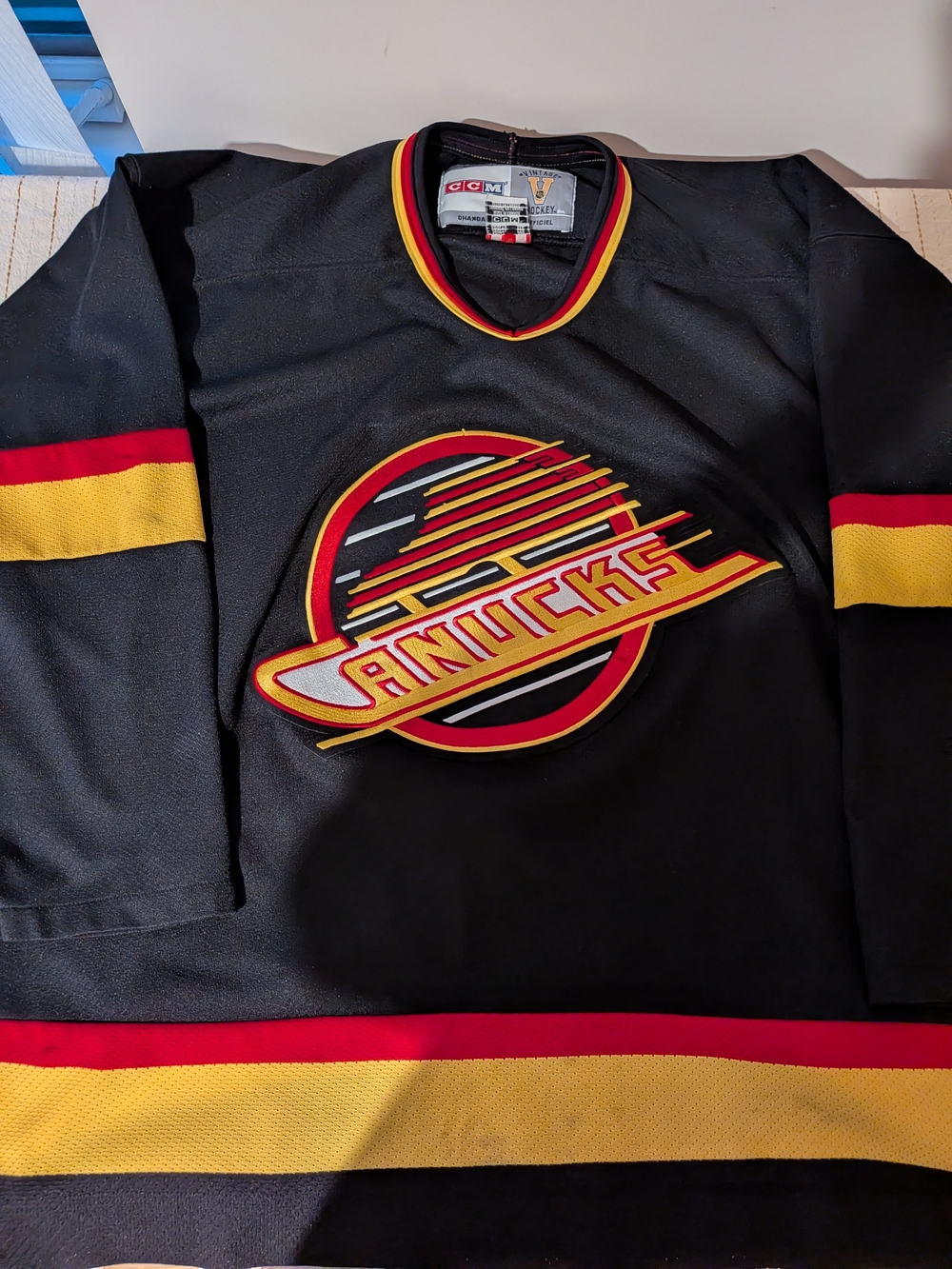 CCM Black Hockey Jersey with Red & Yellow Trim